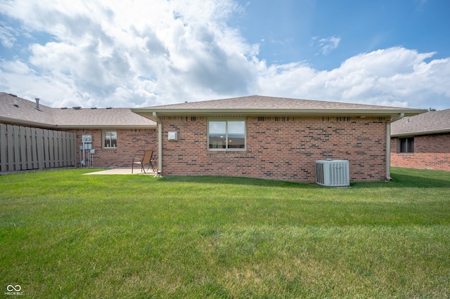 114 Asbury Dr, Anderson, IN 46013 - back of house with brick siding, a patio, and a shingled roof