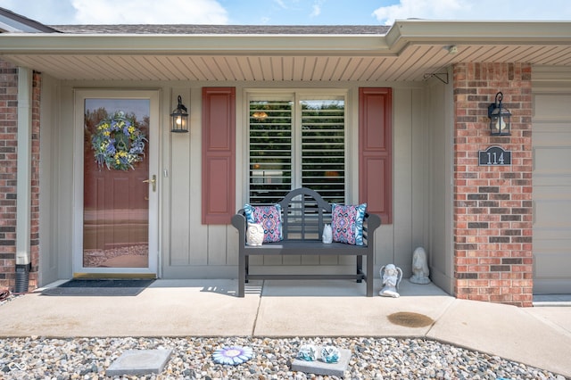 114 Asbury Dr, Anderson, IN 46013 - view of exterior entry featuring brick siding and covered porch