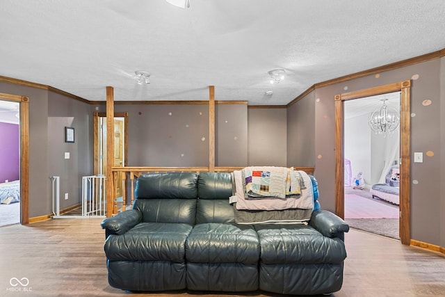 6092 N Jack Morgan Rd, Austin, IN 47102 - living area with wood finished floors, ornamental molding, and a textured ceiling