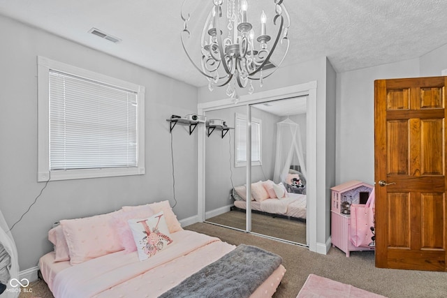 6092 N Jack Morgan Rd, Austin, IN 47102 - bedroom featuring a chandelier, a closet, and carpet