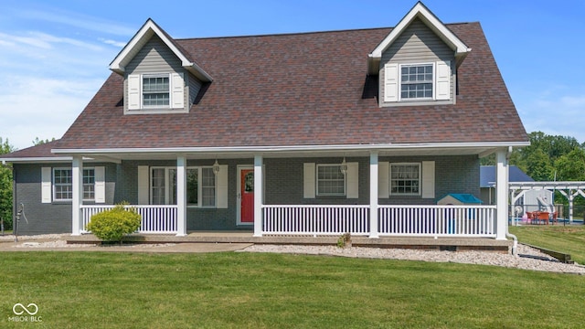 6092 N Jack Morgan Rd, Austin, IN 47102 - view of front of house with brick siding, a front lawn, and a porch