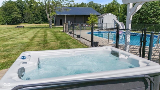 6092 N Jack Morgan Rd, Austin, IN 47102 - view of pool featuring a hot tub, a water slide, and a storage unit