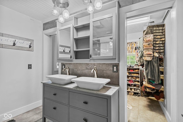 6092 N Jack Morgan Rd, Austin, IN 47102 - bathroom with double vanity and decorative backsplash