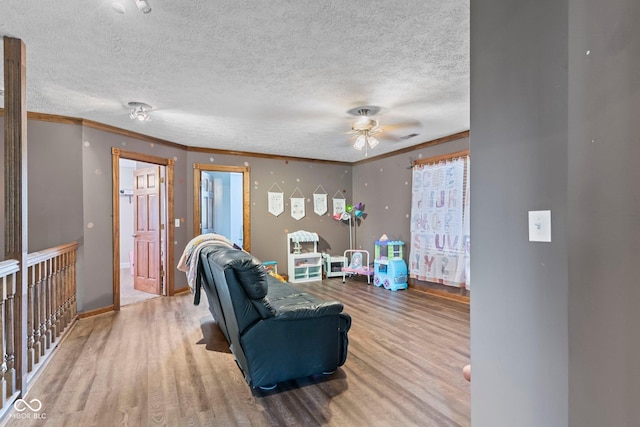 6092 N Jack Morgan Rd, Austin, IN 47102 - living room with wood finished floors, ceiling fan, crown molding, and a textured ceiling