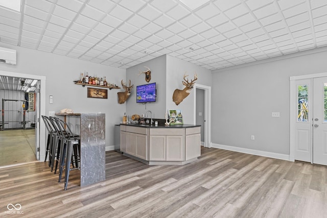 6092 N Jack Morgan Rd, Austin, IN 47102 - indoor wet bar featuring light wood-style floors and an AC wall unit