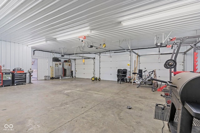 6092 N Jack Morgan Rd, Austin, IN 47102 - garage featuring water heater and a garage door opener