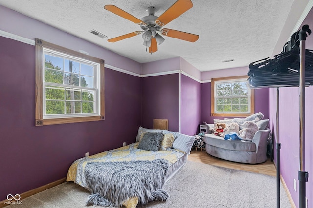 6092 N Jack Morgan Rd, Austin, IN 47102 - bedroom with a ceiling fan, a textured ceiling, and carpet