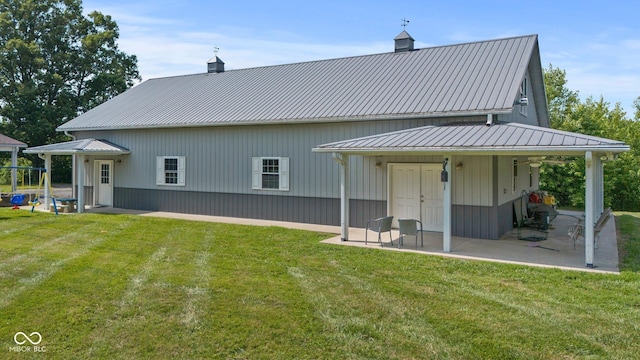 6092 N Jack Morgan Rd, Austin, IN 47102 - rear view of property with a patio, a yard, a chimney, a playground, and a metal roof