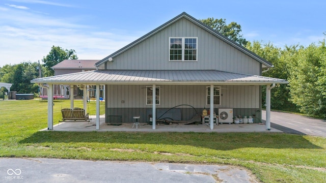 6092 N Jack Morgan Rd, Austin, IN 47102 - farmhouse inspired home with a front yard and a metal roof