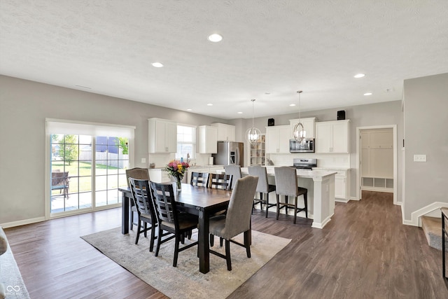 4596 Peabody Way, Westfield, IN 46062 - dining space featuring dark wood-style flooring, a chandelier, recessed lighting, and a textured ceiling
