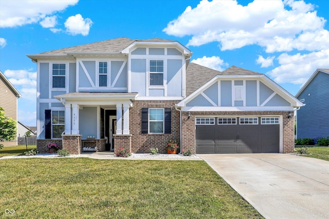 4596 Peabody Way, Westfield, IN 46062 - tudor house featuring stucco siding, concrete driveway, a front lawn, a garage, and brick siding