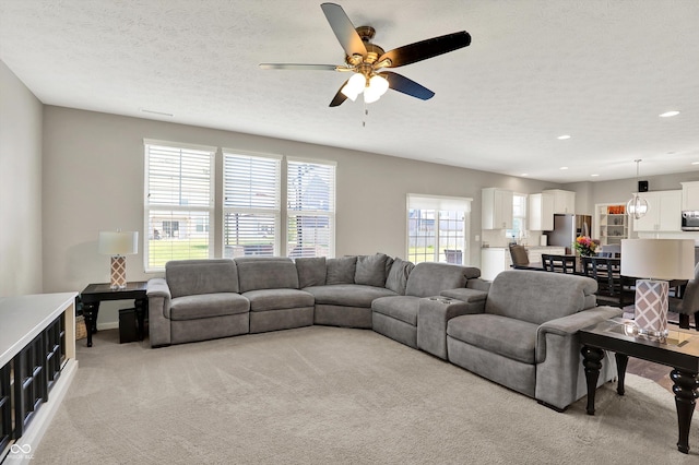 4596 Peabody Way, Westfield, IN 46062 - living area featuring light colored carpet, a ceiling fan, recessed lighting, and a textured ceiling