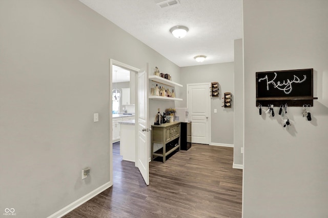 4596 Peabody Way, Westfield, IN 46062 - corridor featuring dark wood-style floors and a textured ceiling