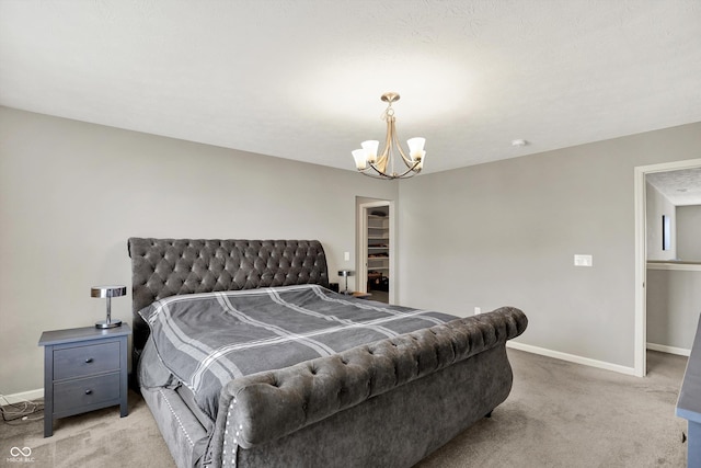 4596 Peabody Way, Westfield, IN 46062 - bedroom featuring light colored carpet, a chandelier, and a spacious closet