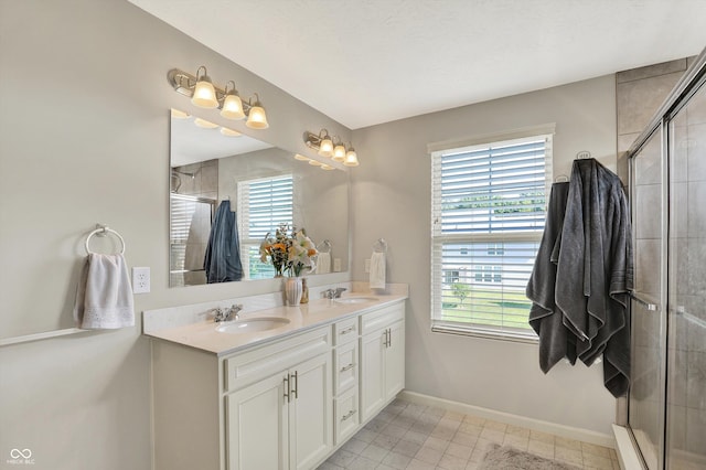4596 Peabody Way, Westfield, IN 46062 - bathroom featuring plenty of natural light, double vanity, and a tile shower