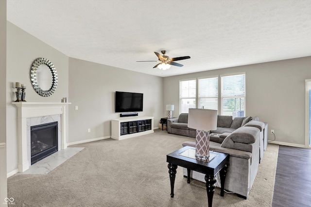 4596 Peabody Way, Westfield, IN 46062 - living area with ceiling fan, a premium fireplace, and a textured ceiling