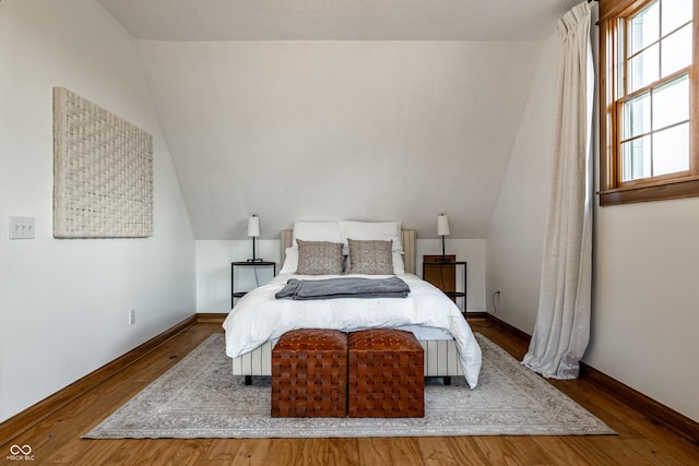 9681 Pleasant View Ln, Zionsville, IN 46077 - bedroom featuring vaulted ceiling and wood finished floors