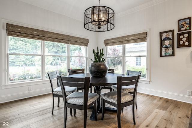 9681 Pleasant View Ln, Zionsville, IN 46077 - dining space with a chandelier, light wood finished floors, and crown molding