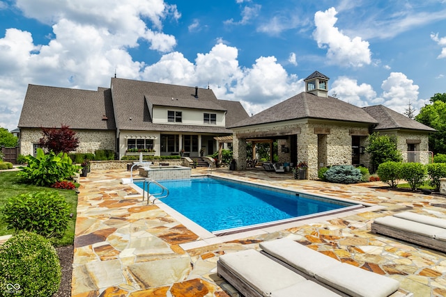 9681 Pleasant View Ln, Zionsville, IN 46077 - view of pool with a patio, a pool with connected hot tub, and an outdoor living space