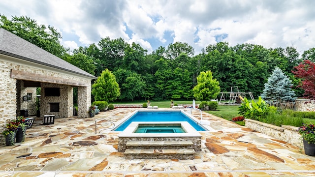9681 Pleasant View Ln, Zionsville, IN 46077 - swimming pool with an outdoor fireplace, a patio, an in-ground hot tub, a yard, and view of wooded area