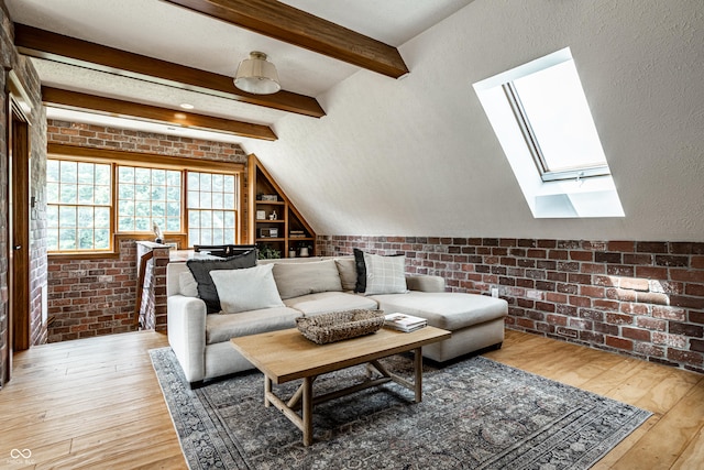 9681 Pleasant View Ln, Zionsville, IN 46077 - living room with a skylight, light wood-style flooring, and brick wall