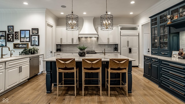9681 Pleasant View Ln, Zionsville, IN 46077 - kitchen featuring stainless steel dishwasher, custom exhaust hood, a chandelier, white cabinetry, and crown molding
