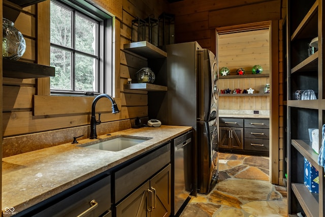 9681 Pleasant View Ln, Zionsville, IN 46077 - kitchen featuring open shelves, stone floors, stainless steel dishwasher, light stone counters, and wooden walls