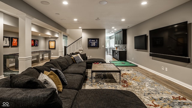 9681 Pleasant View Ln, Zionsville, IN 46077 - living room with stairs, light wood finished floors, decorative columns, and recessed lighting