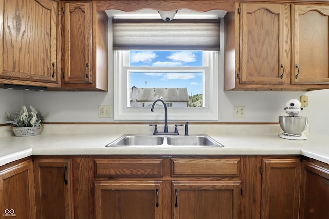 1011 Stevedon Ct, Plainfield, IN 46168 - kitchen featuring light countertops and brown cabinets