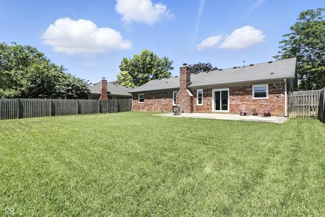 1011 Stevedon Ct, Plainfield, IN 46168 - back of house with a patio area, a fenced backyard, a chimney, and brick siding