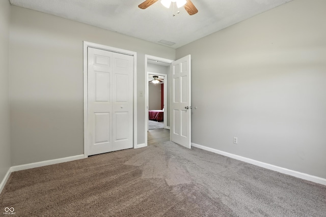 1011 Stevedon Ct, Plainfield, IN 46168 - unfurnished bedroom with carpet, a closet, and a ceiling fan