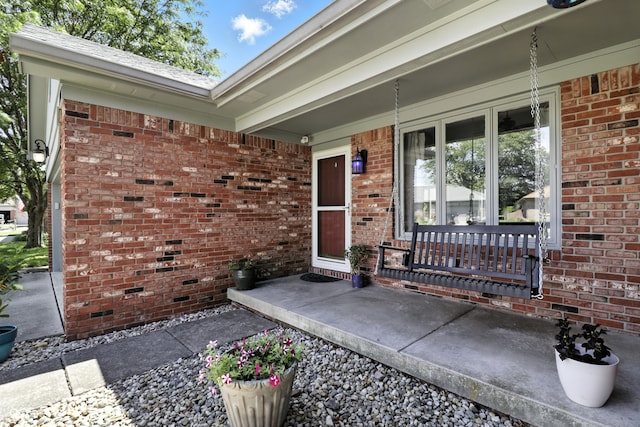 1011 Stevedon Ct, Plainfield, IN 46168 - doorway to property featuring a porch and brick siding