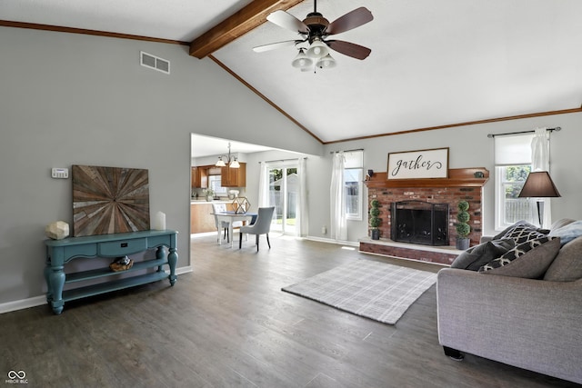 1011 Stevedon Ct, Plainfield, IN 46168 - living area featuring beamed ceiling, a chandelier, a ceiling fan, wood finished floors, and a brick fireplace