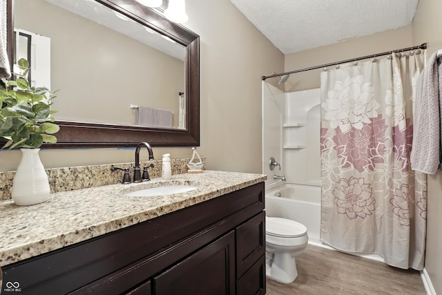1011 Stevedon Ct, Plainfield, IN 46168 - bathroom with wood finished floors, a textured ceiling, shower / bath combination with curtain, and vanity