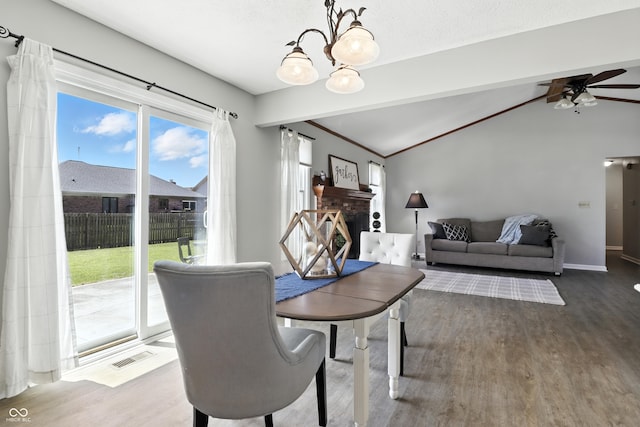 1011 Stevedon Ct, Plainfield, IN 46168 - dining space featuring a chandelier, wood finished floors, ceiling fan, and lofted ceiling