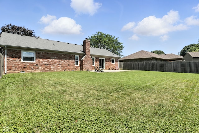 1011 Stevedon Ct, Plainfield, IN 46168 - rear view of property featuring brick siding, a chimney, and a patio area