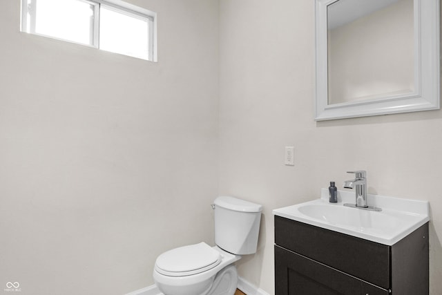 bathroom featuring toilet and vanity