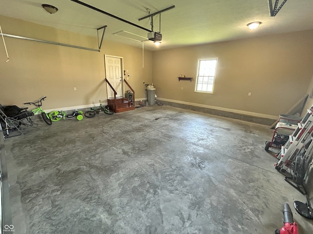 2080 Galway Trl N, Madison, IN 47250 - garage featuring a garage door opener and baseboards