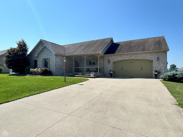 2080 Galway Trl N, Madison, IN 47250 - view of front of home featuring brick siding, a front lawn, a garage, concrete driveway, and a porch