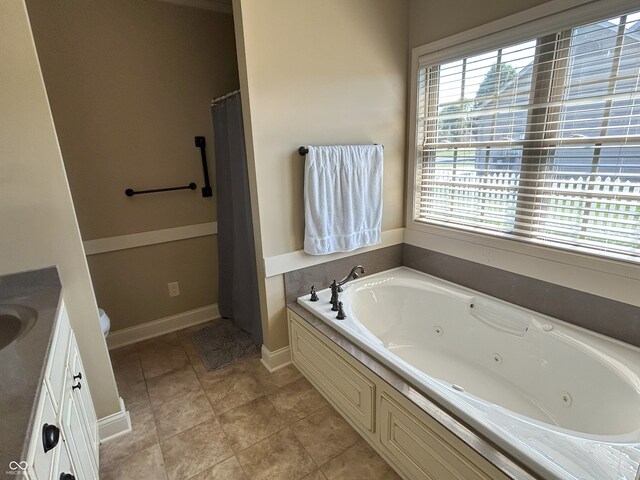 2080 Galway Trl N, Madison, IN 47250 - bathroom featuring a tub with jets, plenty of natural light, and vanity