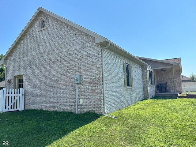 2080 Galway Trl N, Madison, IN 47250 - view of home's exterior with ceiling fan and brick siding