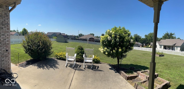 2080 Galway Trl N, Madison, IN 47250 - fenced backyard featuring a patio area, a garden, and a residential view