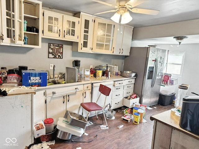 1510 E Locust St, Petersburg, IN 47567 - kitchen featuring stainless steel fridge, light countertops, a ceiling fan, wood finished floors, and cream cabinets