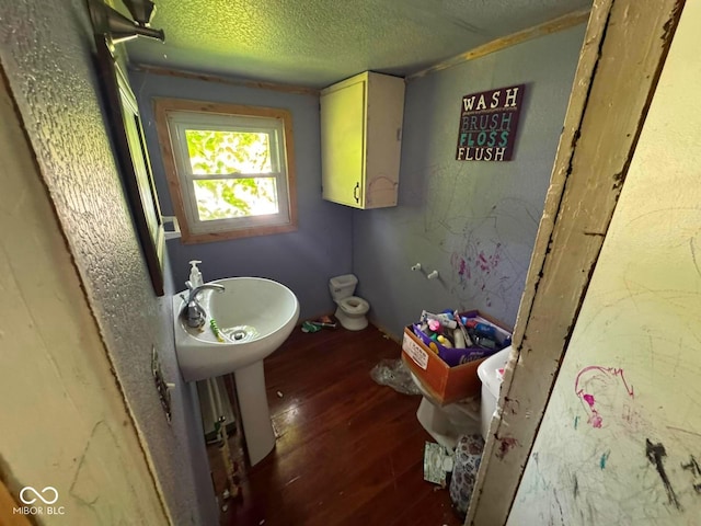 1510 E Locust St, Petersburg, IN 47567 - bathroom featuring a textured ceiling and wood finished floors