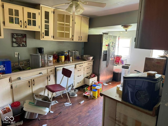 1510 E Locust St, Petersburg, IN 47567 - kitchen with stainless steel refrigerator with ice dispenser, light countertops, dark wood-type flooring, ceiling fan, and cream cabinetry