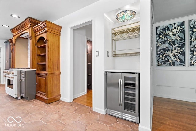 6470 Around The Hills Rd, Indianapolis, IN 46226 - bar area with beverage cooler, recessed lighting, and high end stove