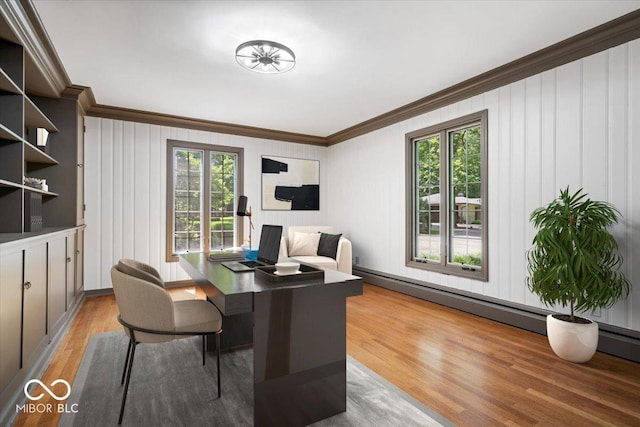 6470 Around The Hills Rd, Indianapolis, IN 46226 - dining space featuring ornamental molding, light wood finished floors, a desk, baseboard heating, and a decorative wall