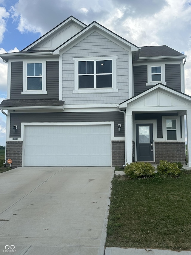 269 Switchgrass Ln, New Whiteland, IN 46184 - craftsman-style house featuring brick siding, a garage, driveway, and a front lawn
