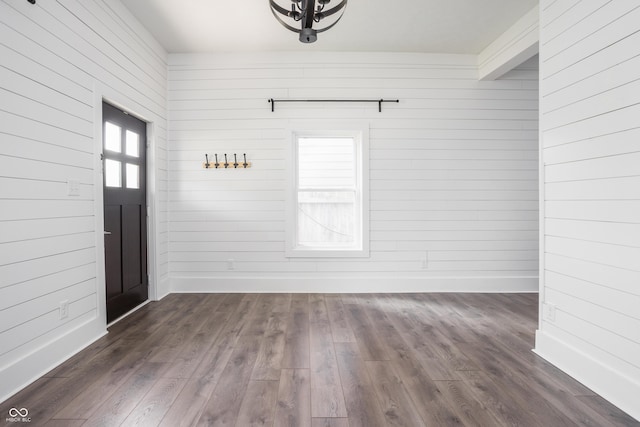 1456 Fletcher Ave, Indianapolis, IN 46203 - foyer entrance with dark wood-style flooring, wood walls, and a chandelier