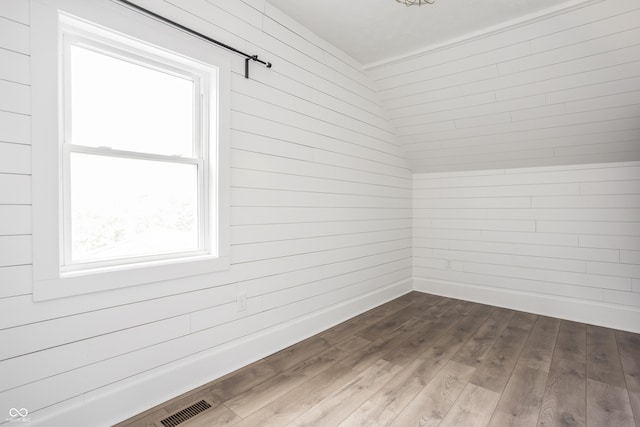 1456 Fletcher Ave, Indianapolis, IN 46203 - additional living space featuring dark wood-style flooring and wooden walls